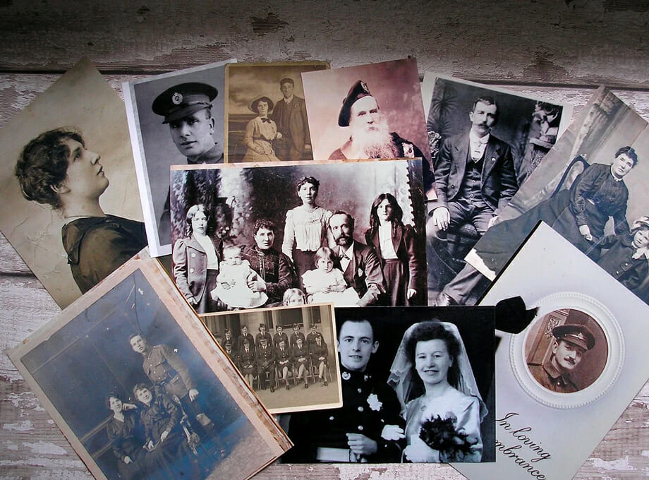Multiple old photographs on display.