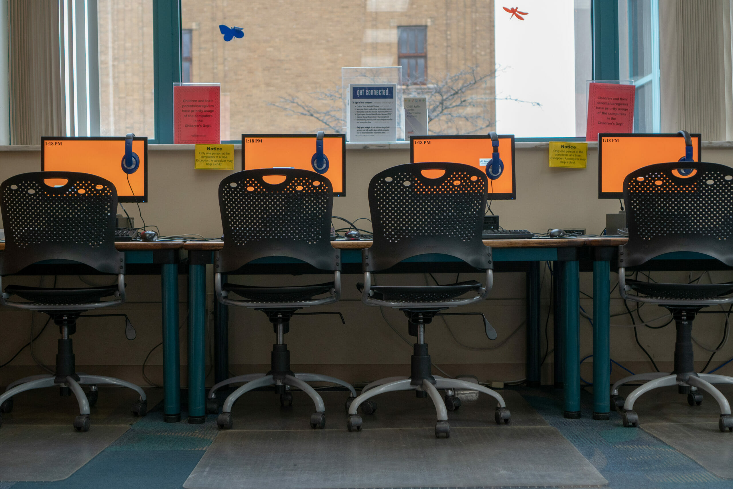 A row of desktop computers in the Main Library.