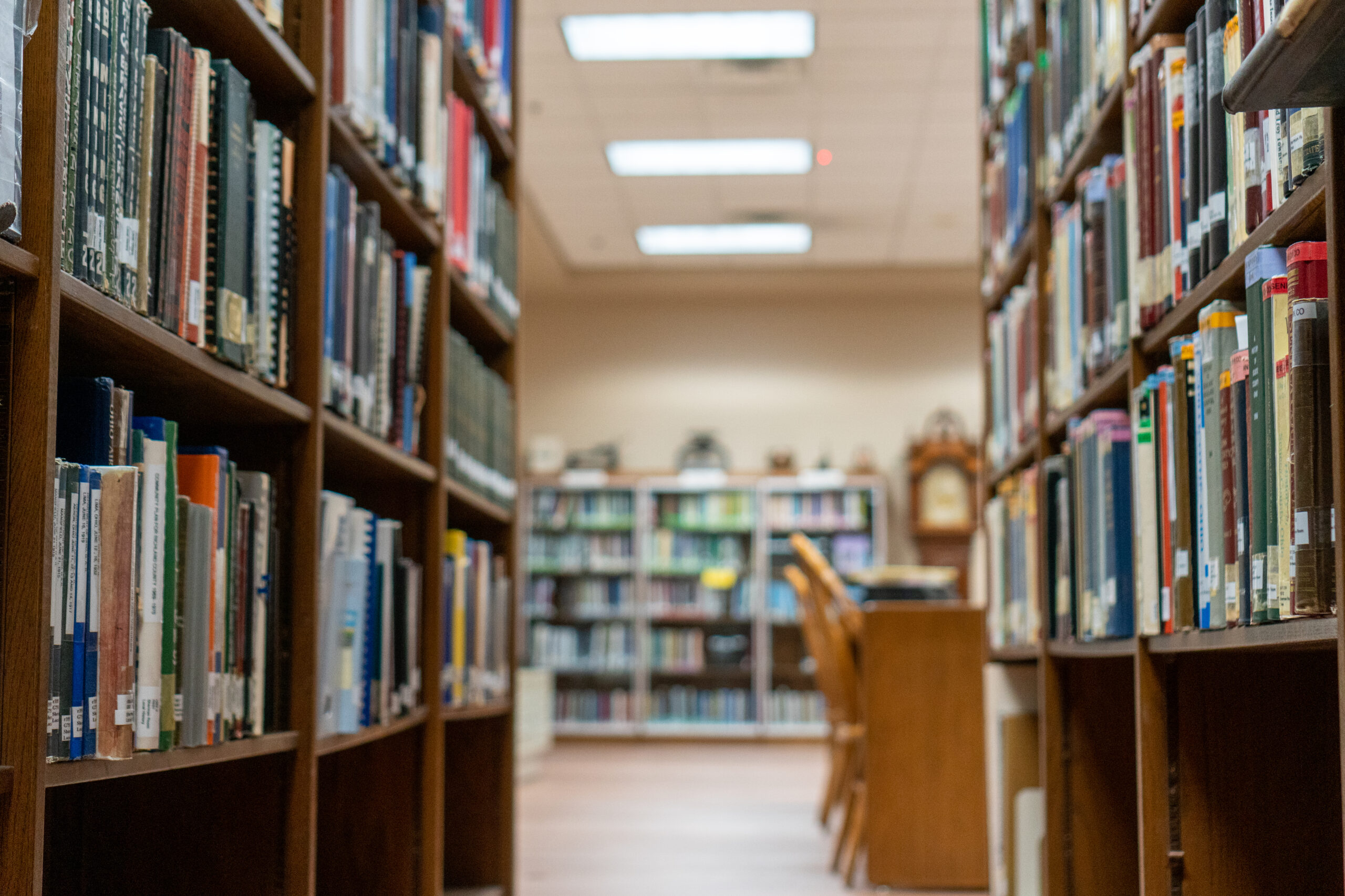 Close up of the interior of the Sherman Room at the Main Library with shelves of books and a worktable.