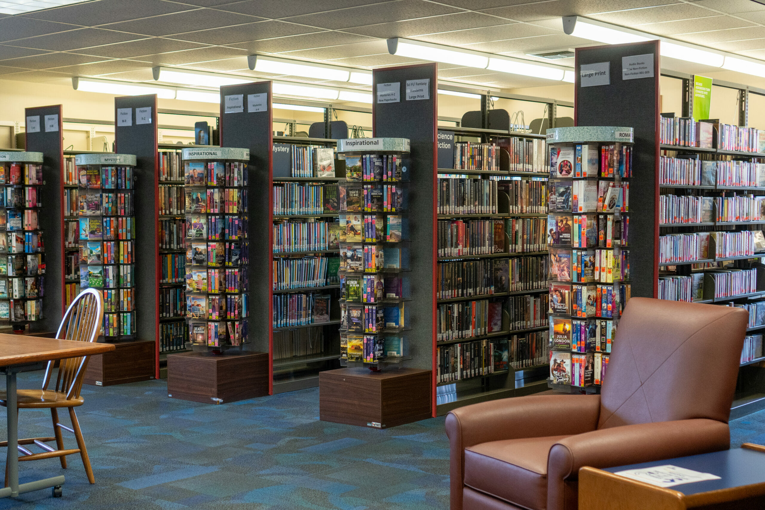 Aisles of full bookshelves at the Madison library.
