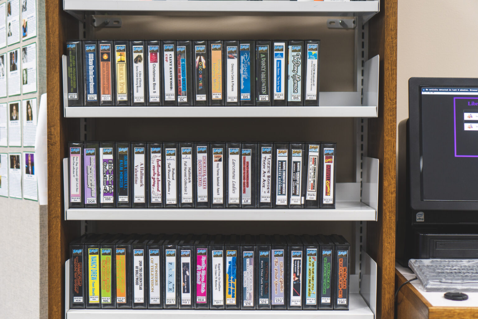 Three shelves containing binge boxes of DVDS at the Main Library in the media services department at the Main Library