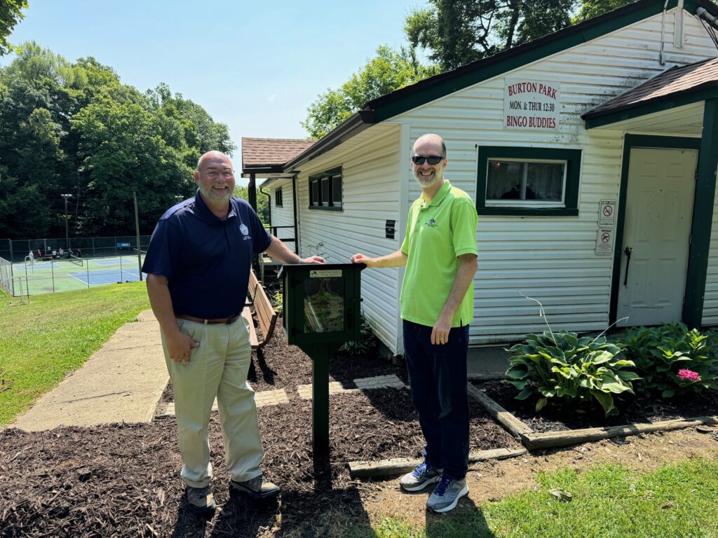 Library Director and Mansfield City Parks pose for Little Free Library at Burton Park