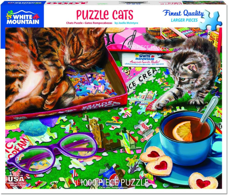 Cats playing with puzzle pieces.