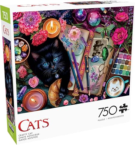 a cat on a notebook with flowers candles and paint