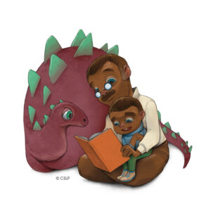 Parent reading to child next to a dinosaur